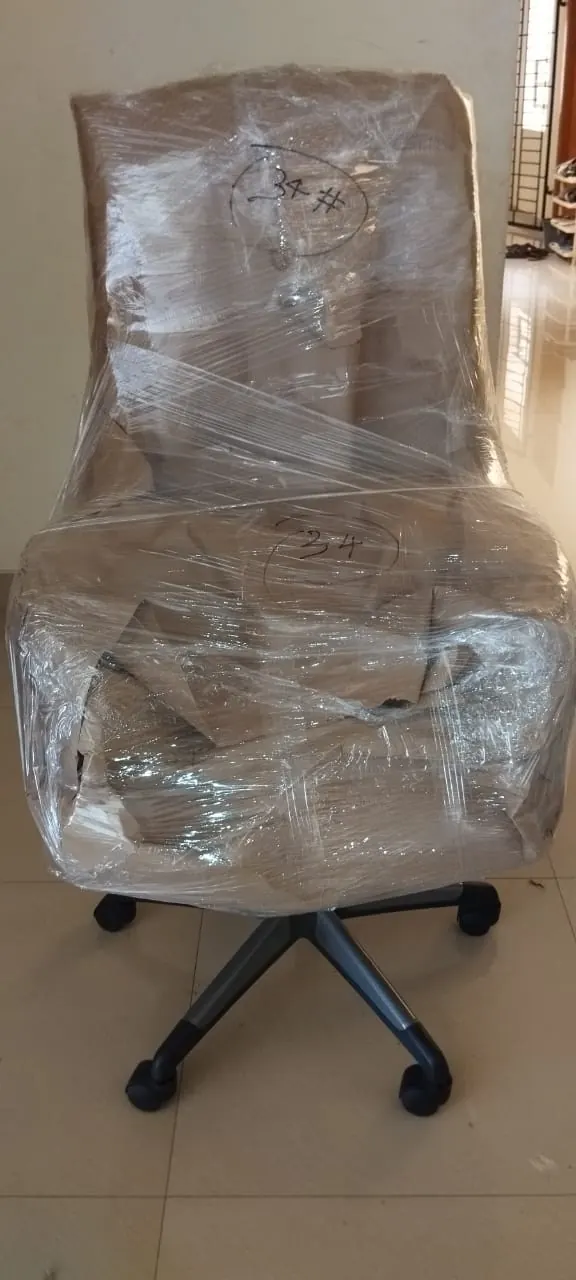 Office chair wrapped in stretch film for shifting